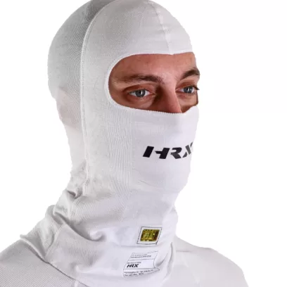 a close up shot of a hrx model wearing the Icon Nomex balaclava