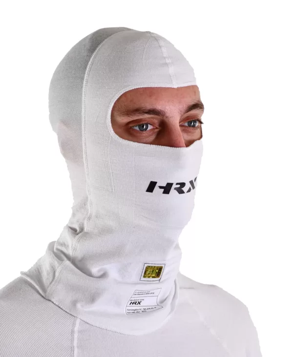 a close up shot of a hrx model wearing the Icon Nomex balaclava